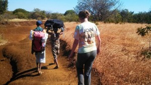 Kim hiking to a rural village to undertake research.